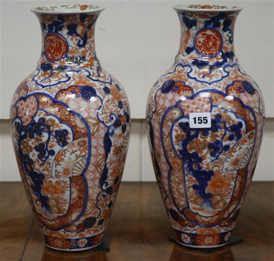 A pair of Imari vases, blue and white pottery and ironstone wares